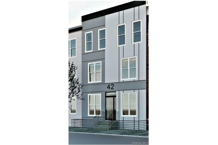 View of front of home featuring stucco siding