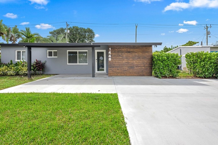 This is your next home with a striking modern exterior with refined curb appeal, featuring a sleek architectural façade, designer wood-accent entry, a