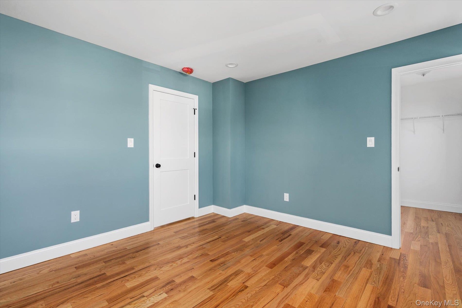 Unfurnished room featuring wood finished floors