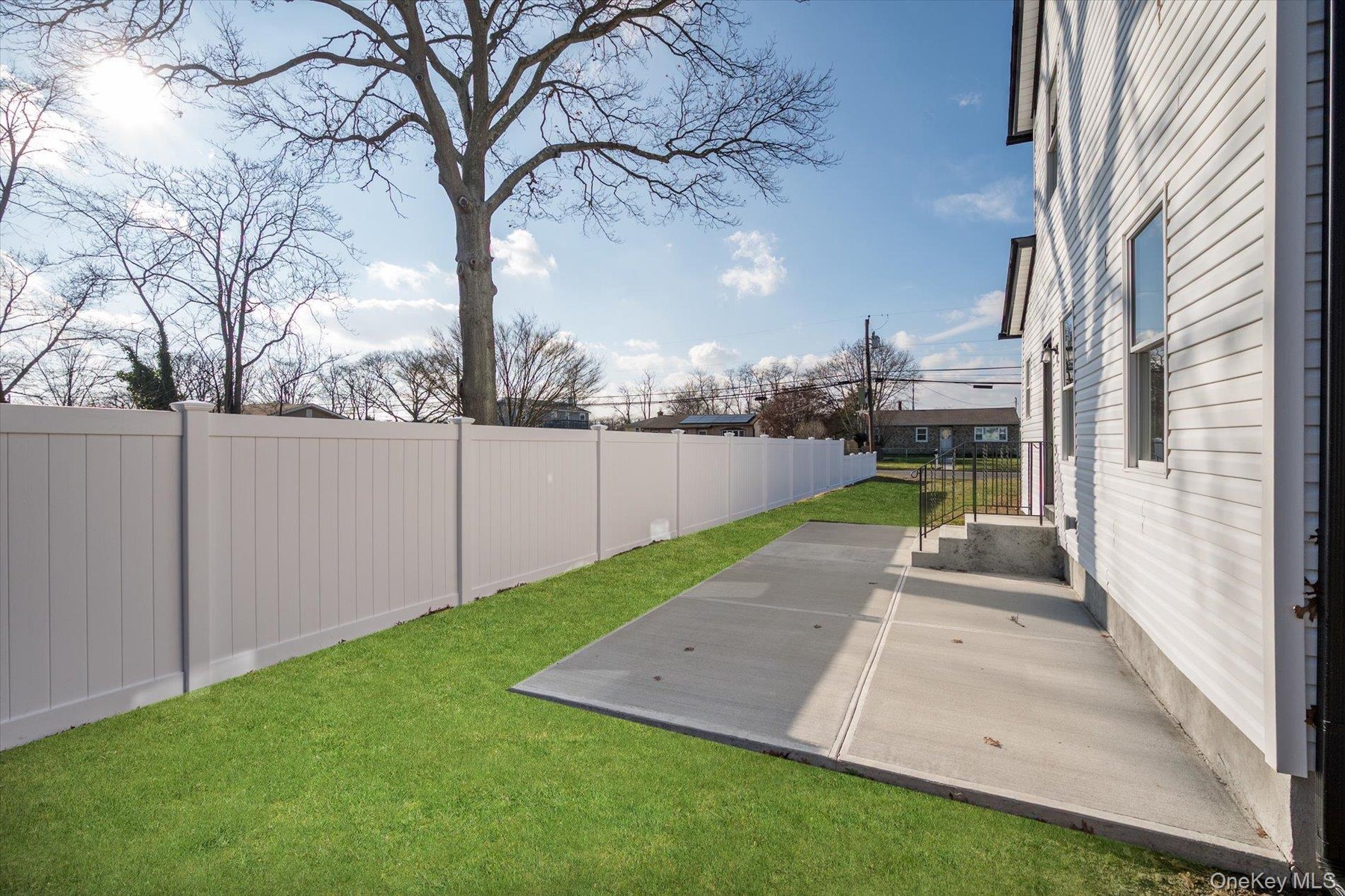 Fenced backyard featuring a patio area