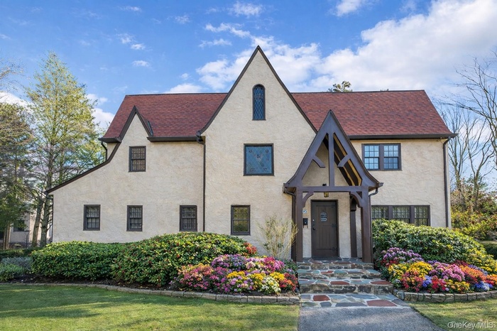 Welcome to 45 Wilmot Road...an estate-like property offering exceptional privacy and timeless architectural presence.