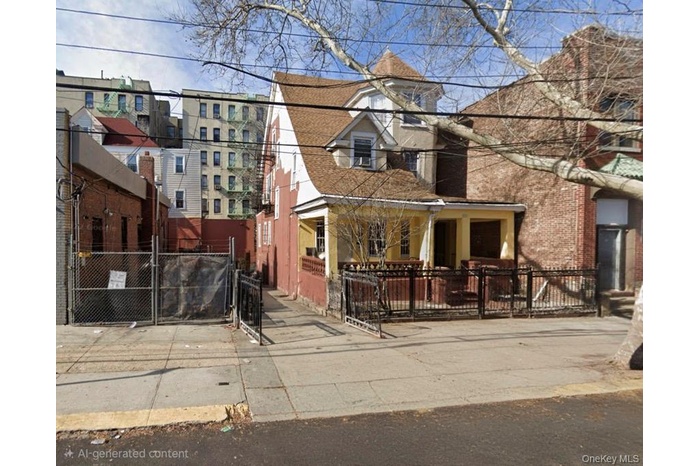 View of front facade featuring a fenced front yard, brick siding, and a gate