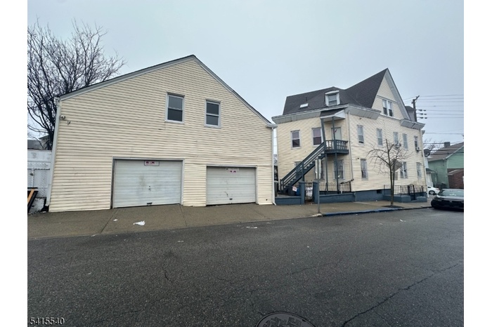 Back of house with garage