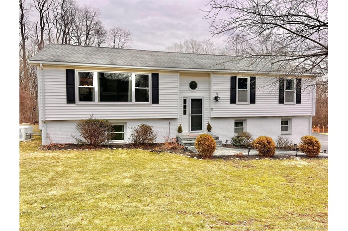 Welcome to 4 Stonewall Farm Road, Mahopac. A rare legal mother/ daughter with walk out lower level apartment great for extended family.