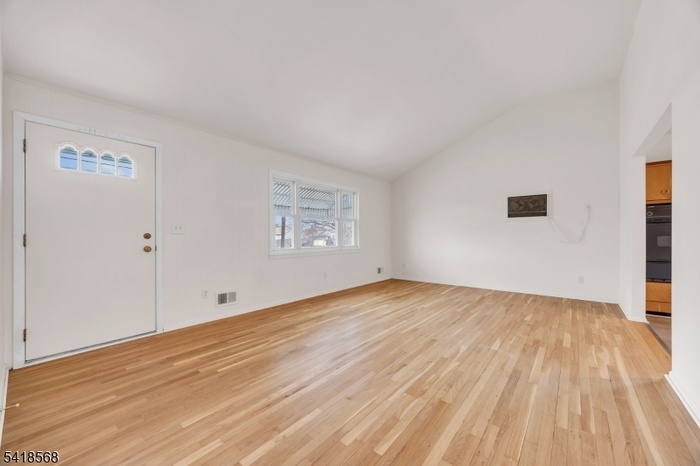 DRAMATIC VAULTED CEILING!