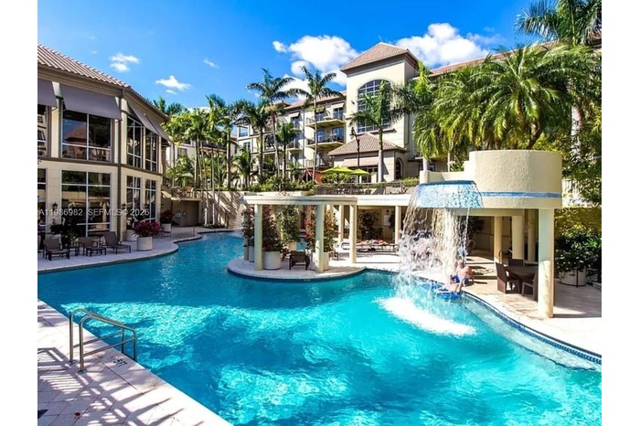 View of outside and the pool as one waits for the elevator.