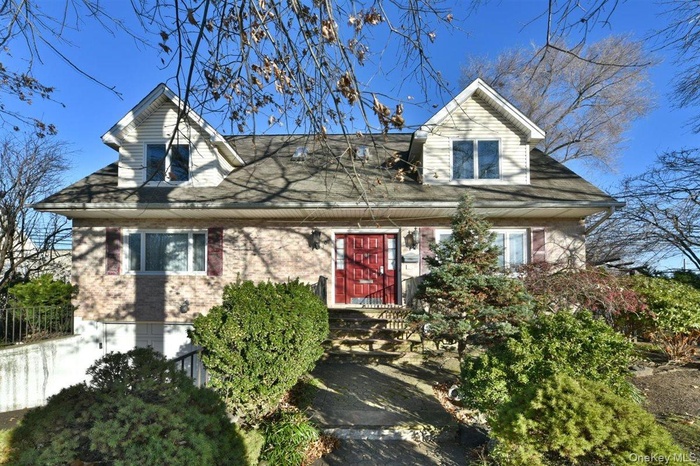 View of front facade featuring brick siding