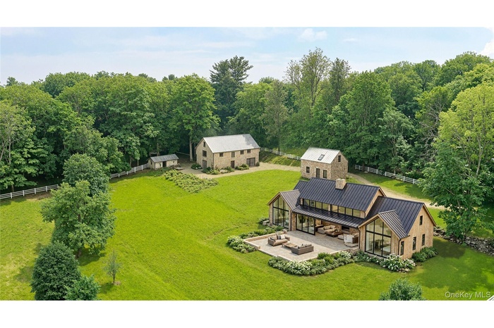 Proposed Main House rendering with existing Barn, Carriage House, and Milk House
