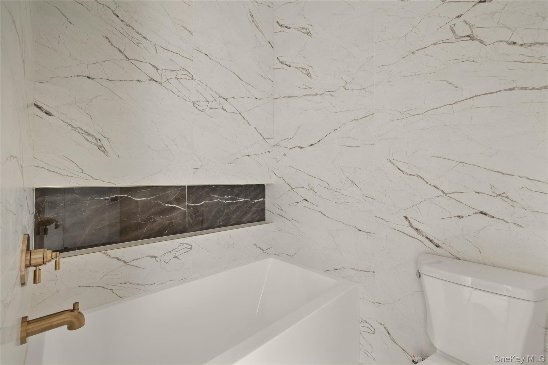 Full bath with a bath and toilet