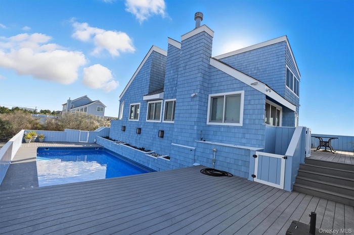 Heated pool surrounded by spacious decking