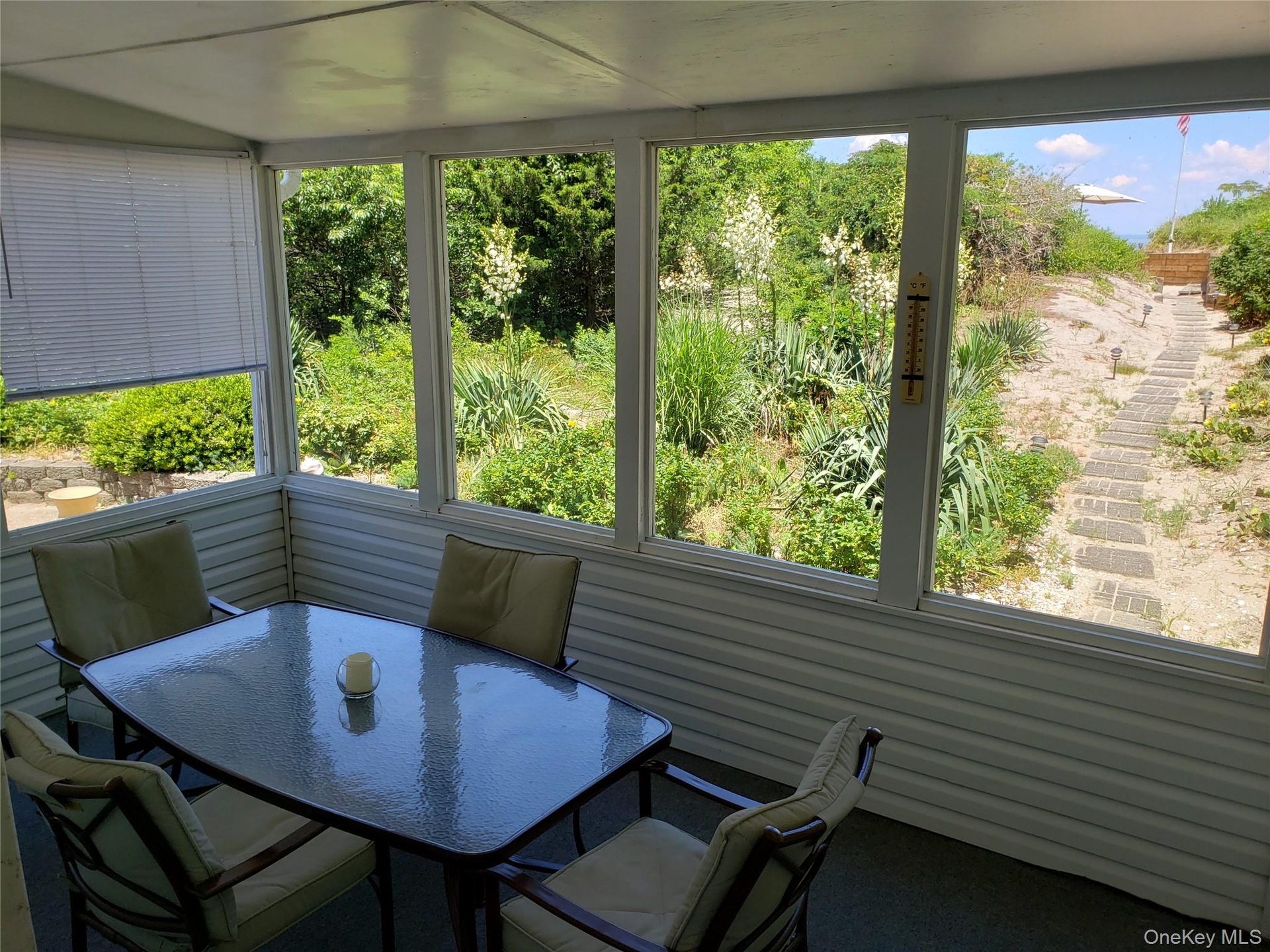 Sunroom featuring outdoor dining area