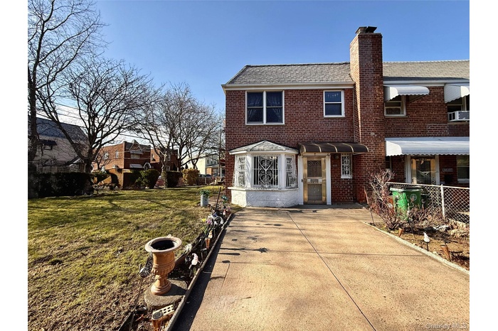 Semidetached brick home. Lot 38x129 Building 20x40 No basement