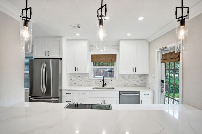 Modern Kitchen featuring quartz countertops and sleek stainless steel appliances.