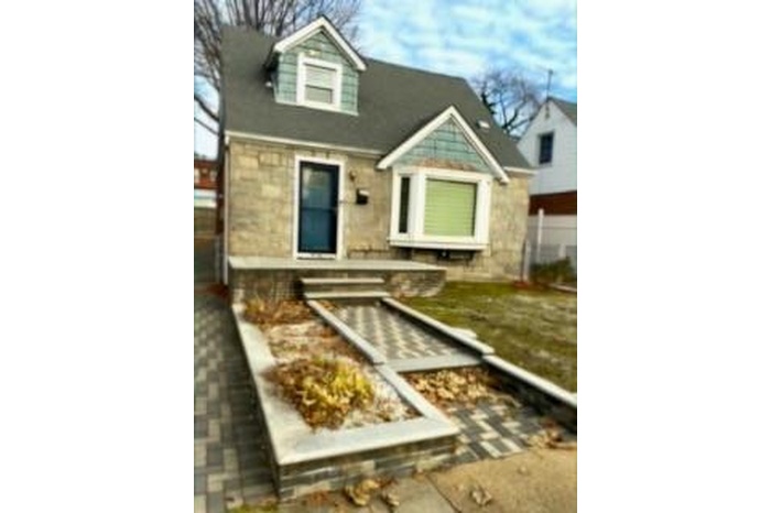 View of front of house with stone siding