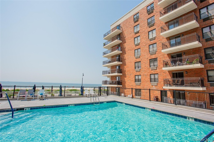 Community pool with a water view