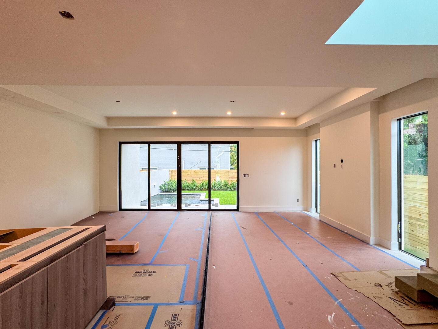 (as of April 8, 2026) the kitchen anchors the first floor living space, quartz countertops to be installed, featuring kitchen aid professional applian