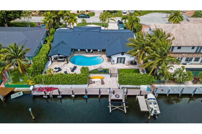 Gorgeous renovated deepwater home features metal roof, impact windows and customs upgrades throughout