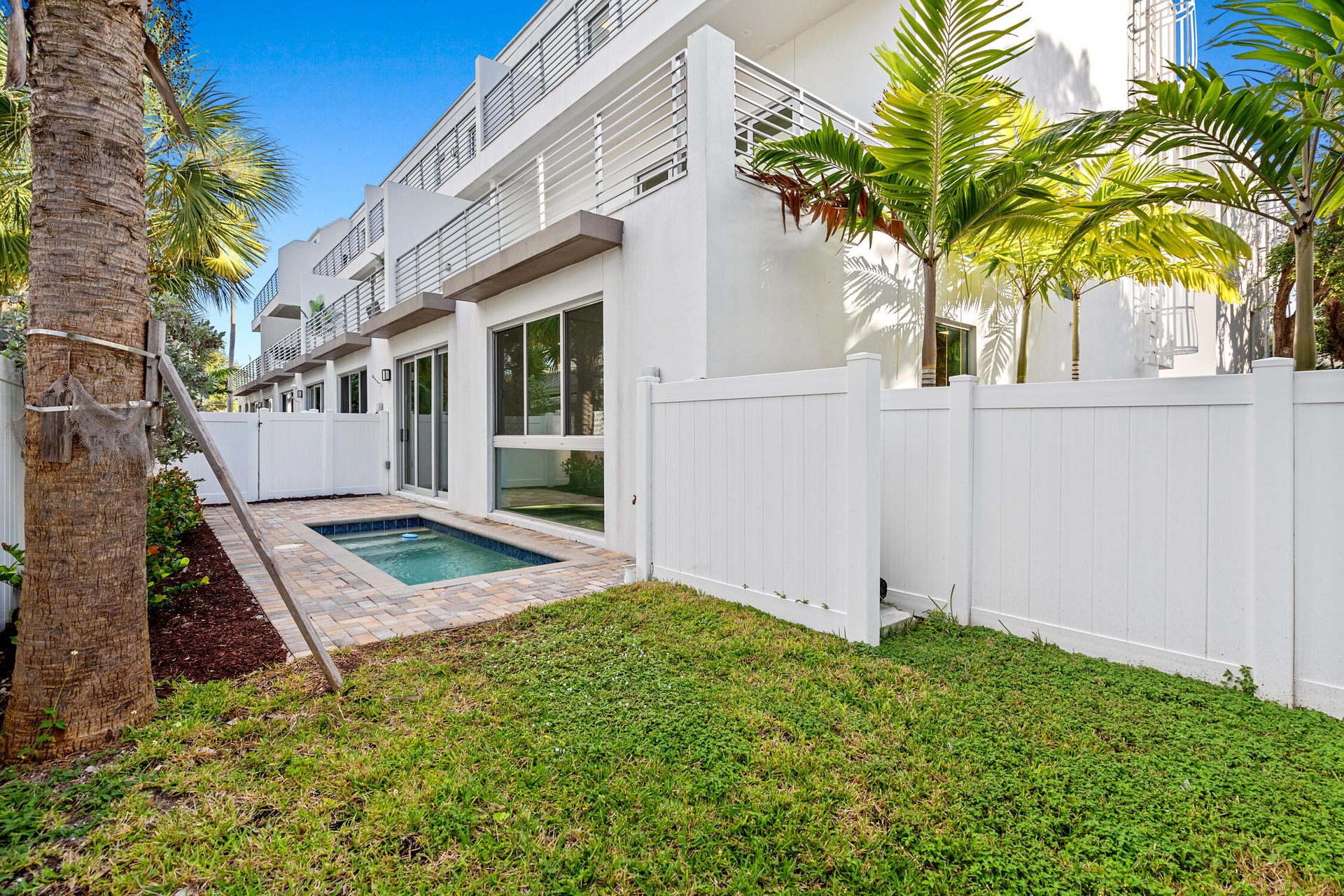 Enjoy relaxing days lounging by your private pool as well as grass space perfect for pets and time spent outside.