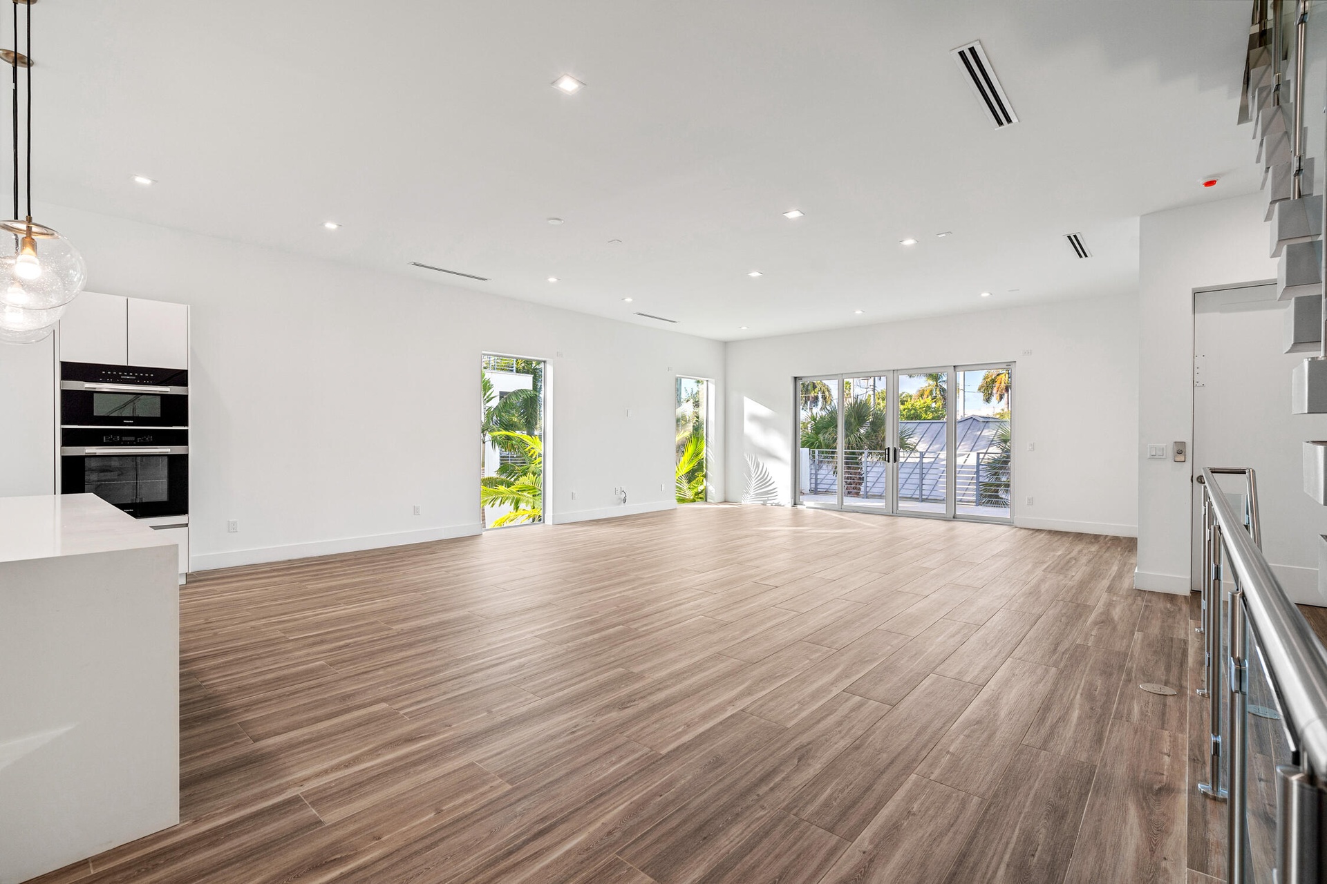 Natural light cascades throughout this exceptional corner unit