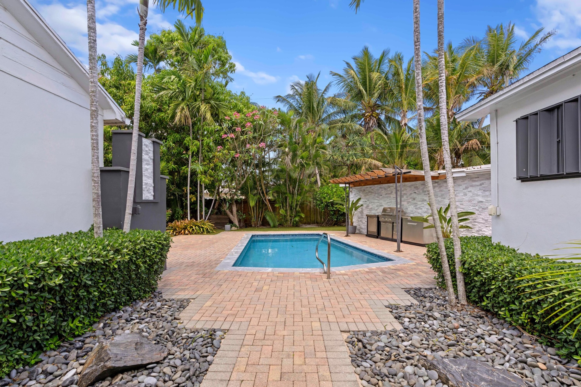 Back patio, pool, and outdoor kitchen.