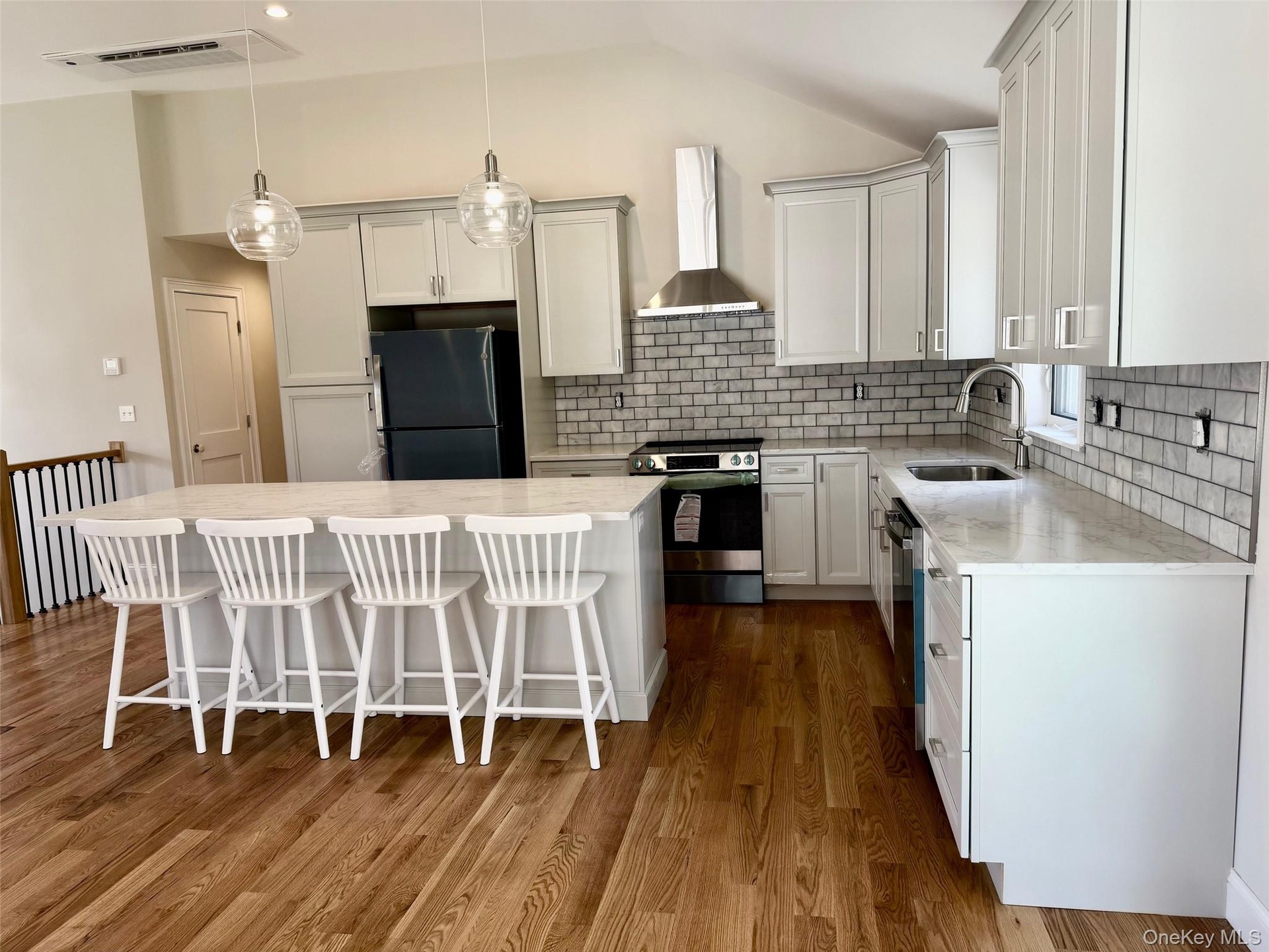 Hardwood floors throughout. Top quality cabinetry, backsplash