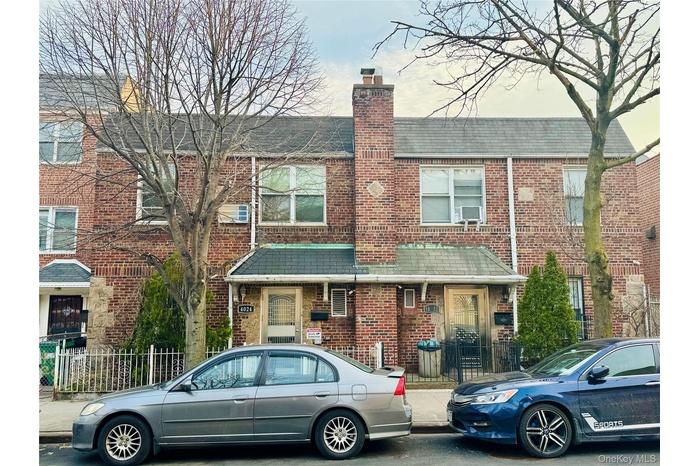 The property features a brick exterior with a pitched roof