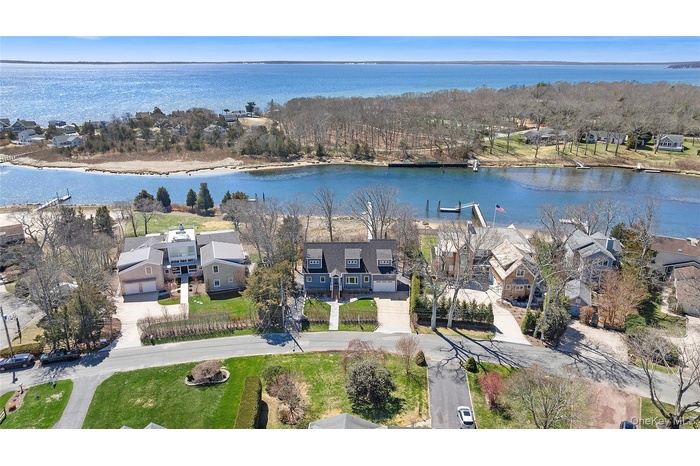 Built in 2022 - A rare waterfront offering where your private deep water dock meets wide open creek with direct access to the Peconic Bay.
