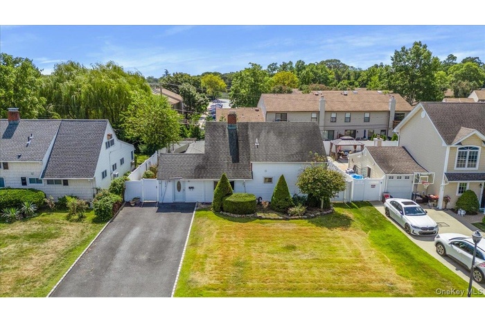 Aerial perspective of suburban area with a tree filled landscape