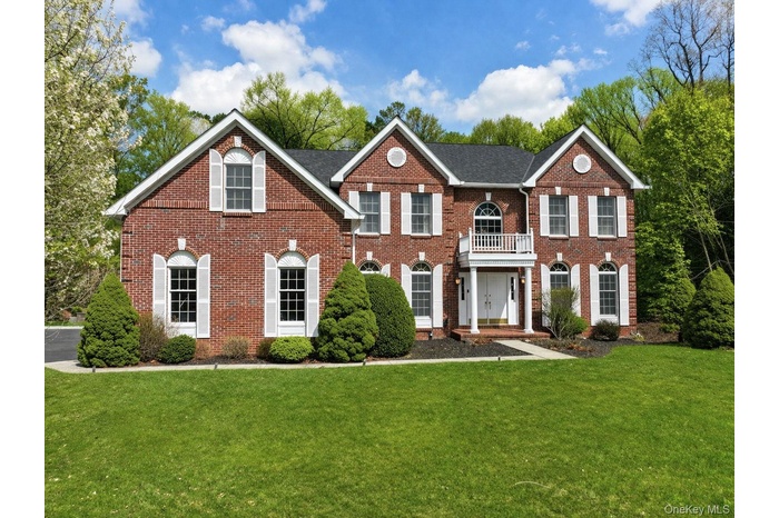 Brick center hall colonial.