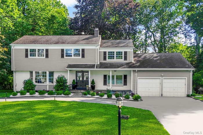 Sunny, updated Rye Colonial with partial water views in sought-after Greenhaven.