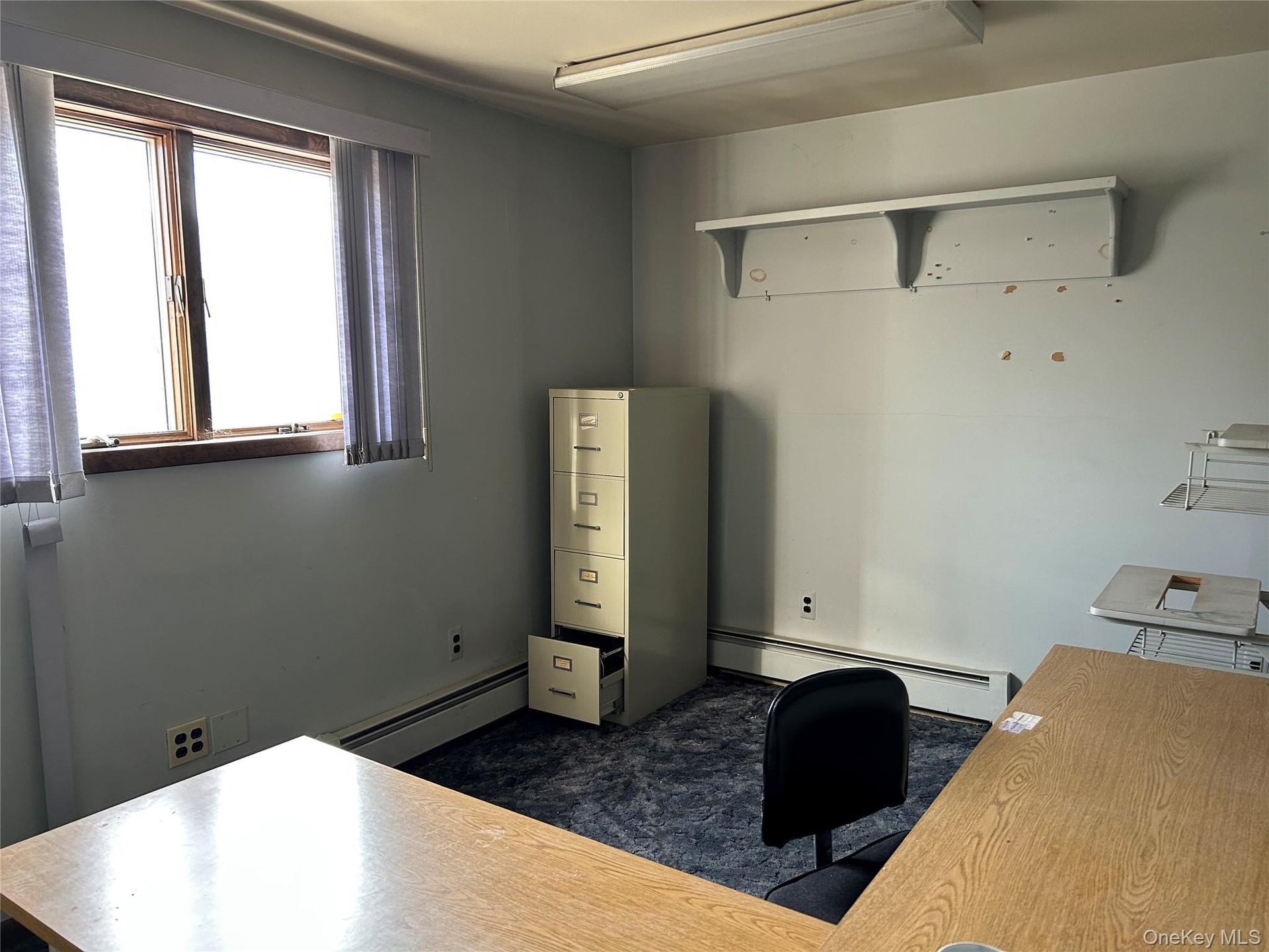 Office space featuring baseboard heating