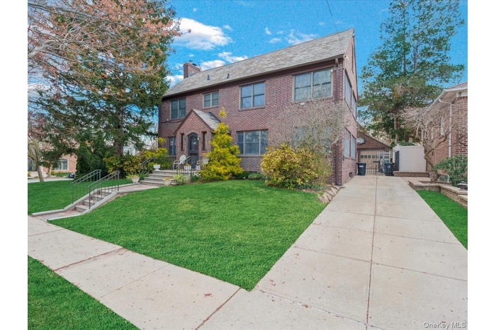 Side view including driveway.