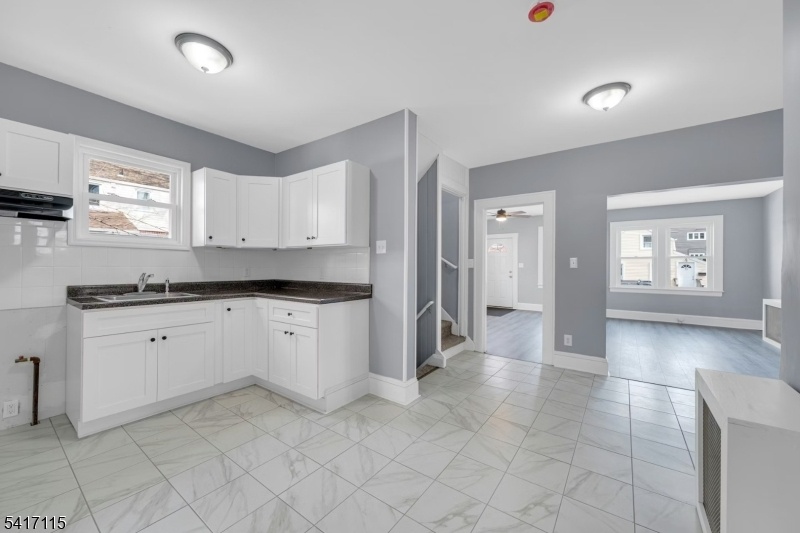 Kitchen with ceramic floors.