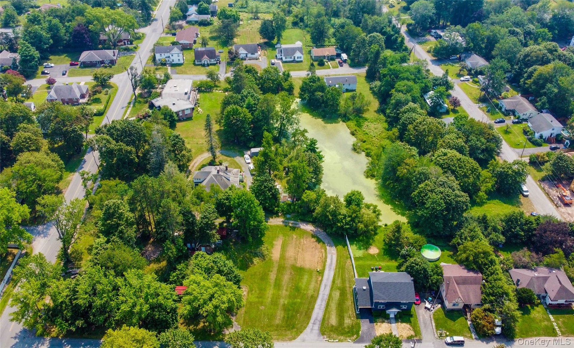 View of property location with nearby suburban area