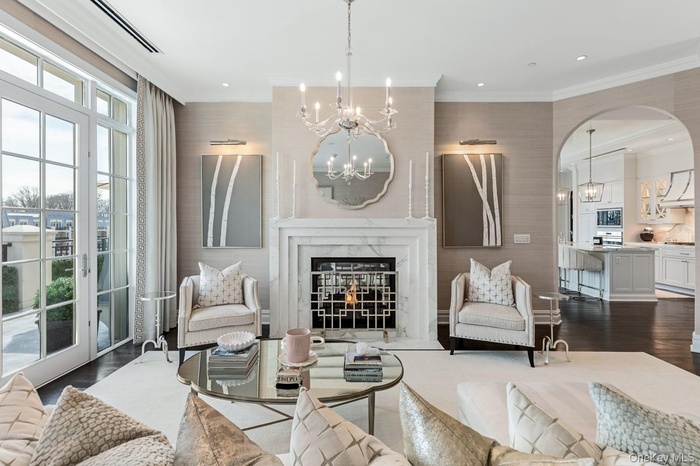 Living room with Calacatta Borghini marble fireplace