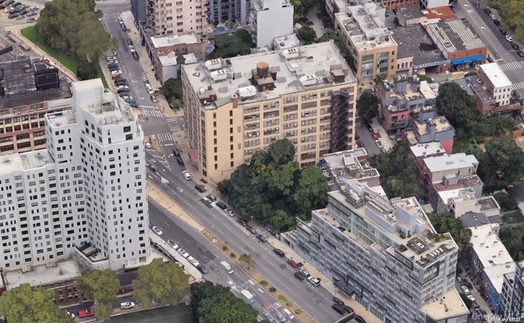 Aerial view of property's location with nearby urban area