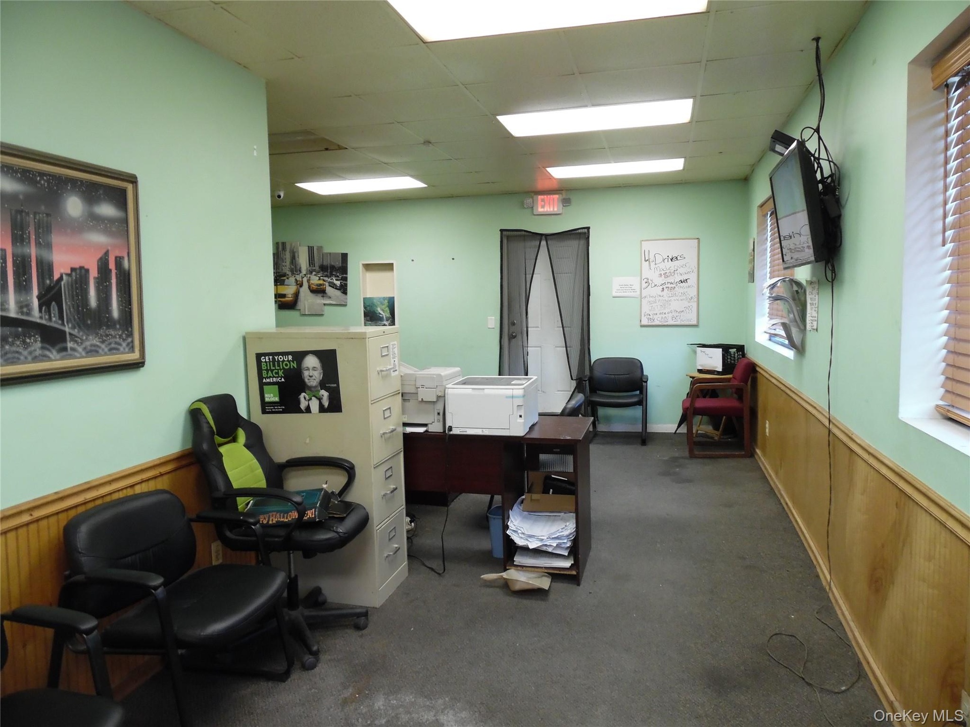 Home office with a wainscoted wall, wood walls, and a paneled ceiling