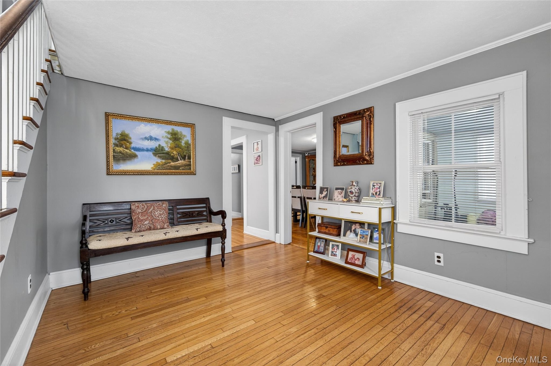 Spacious open entry with hardwoods and hall coat closet.