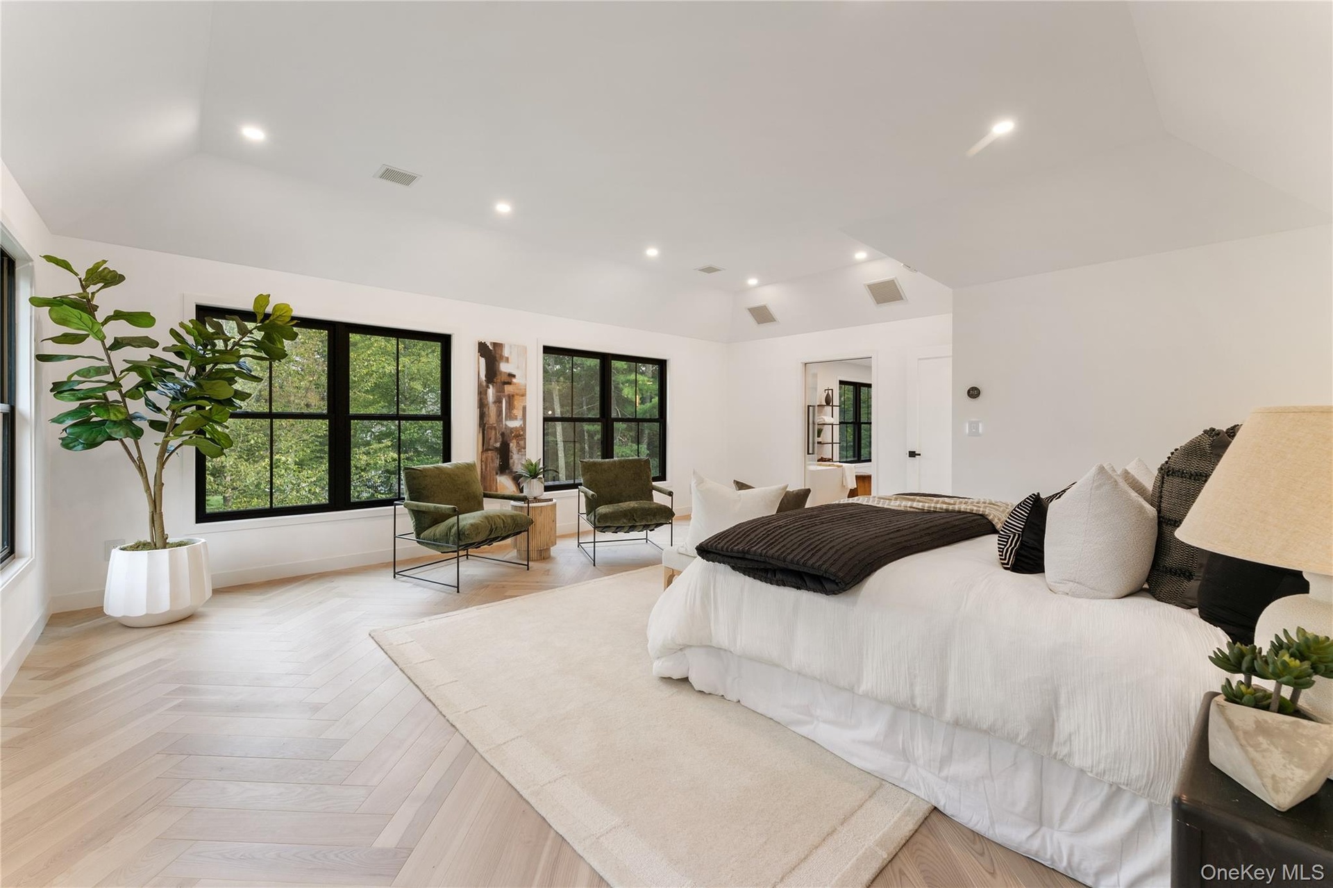 Bedroom featuring recessed lighting and lofted ceiling