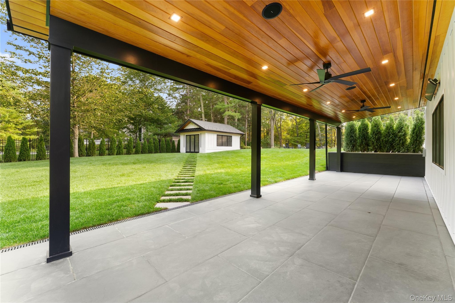View of patio featuring an outdoor structure