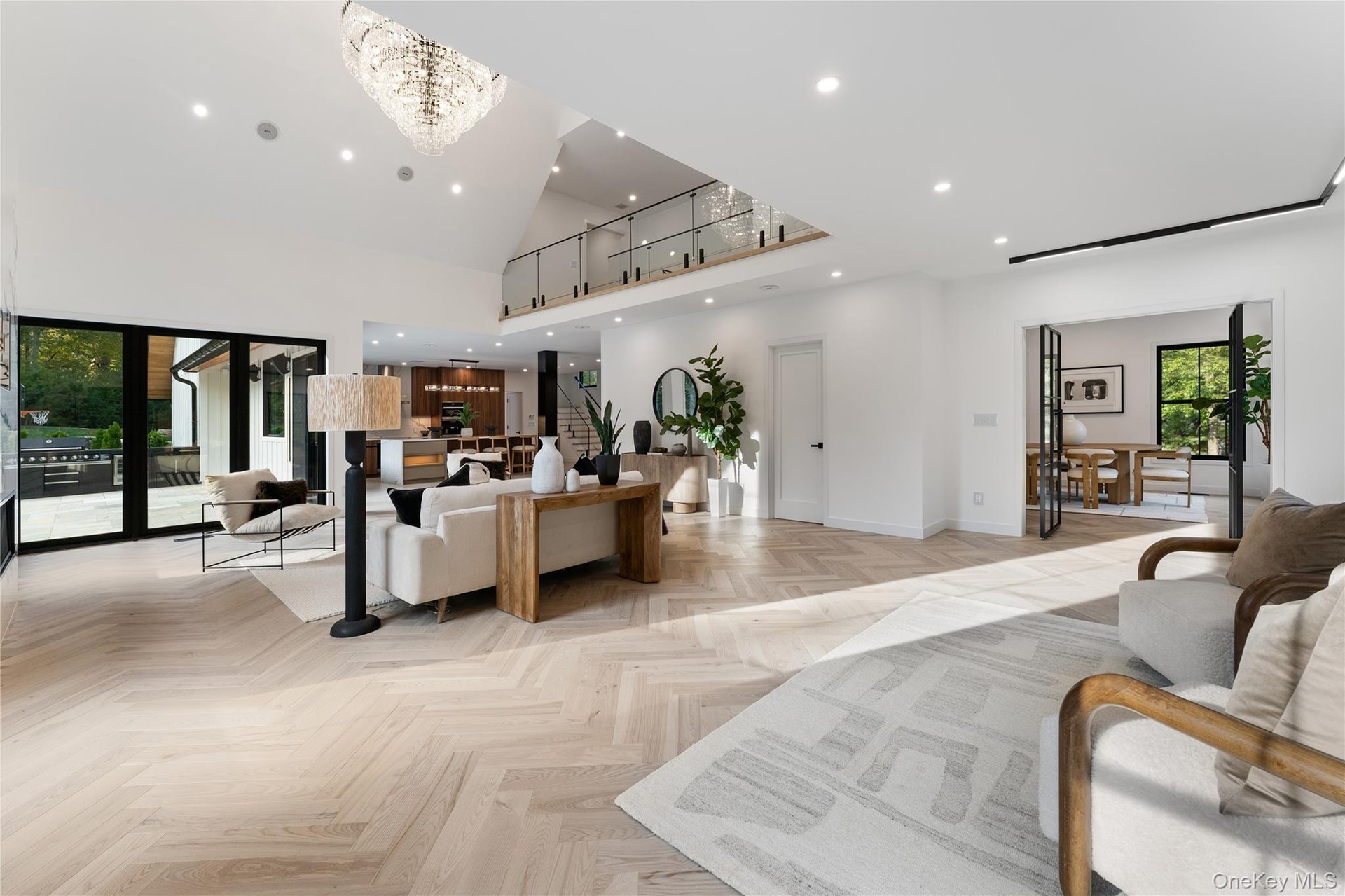 Living Room featuring recessed lighting and a high ceiling