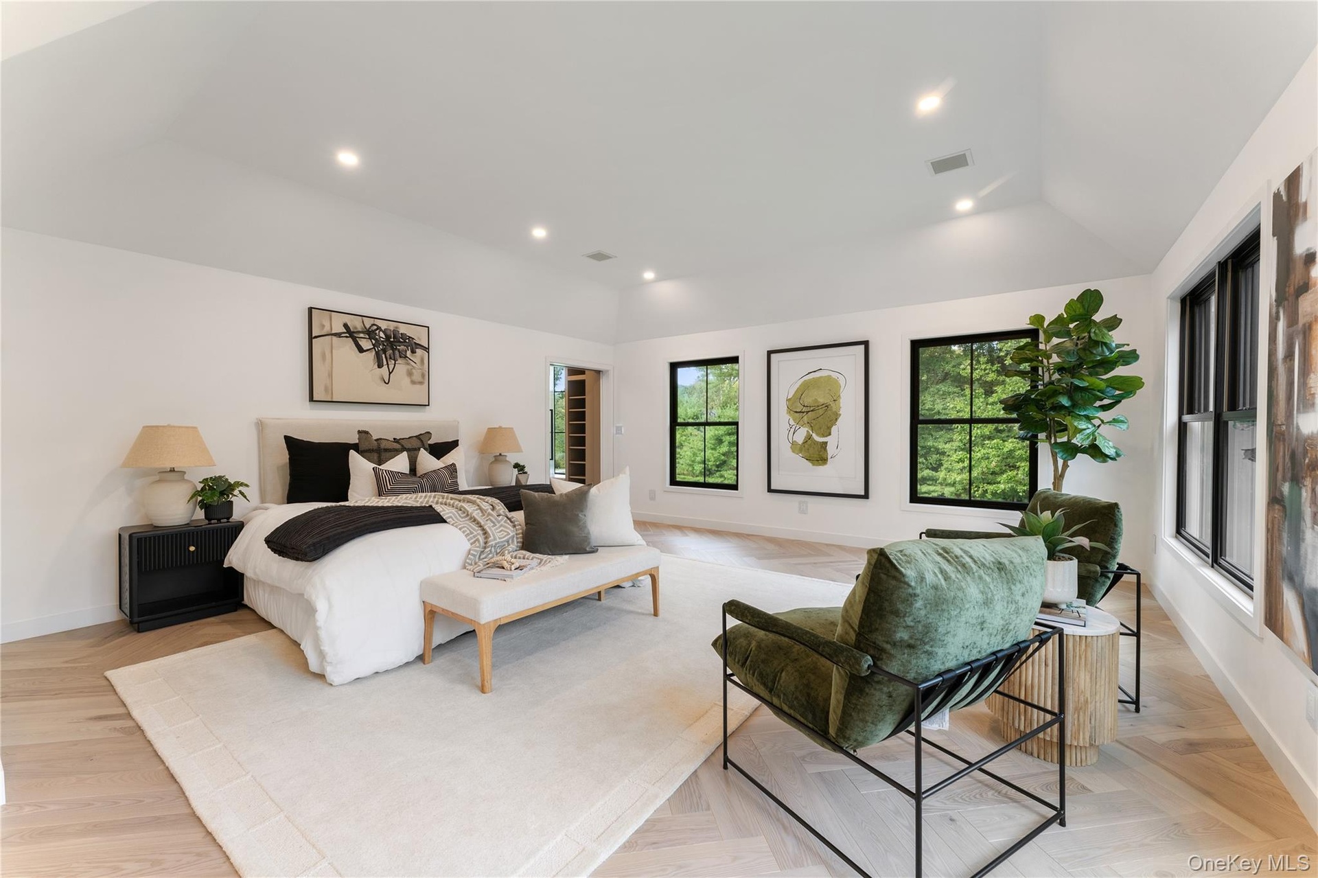Bedroom featuring recessed lighting, vaulted ceiling, and parquet flooring