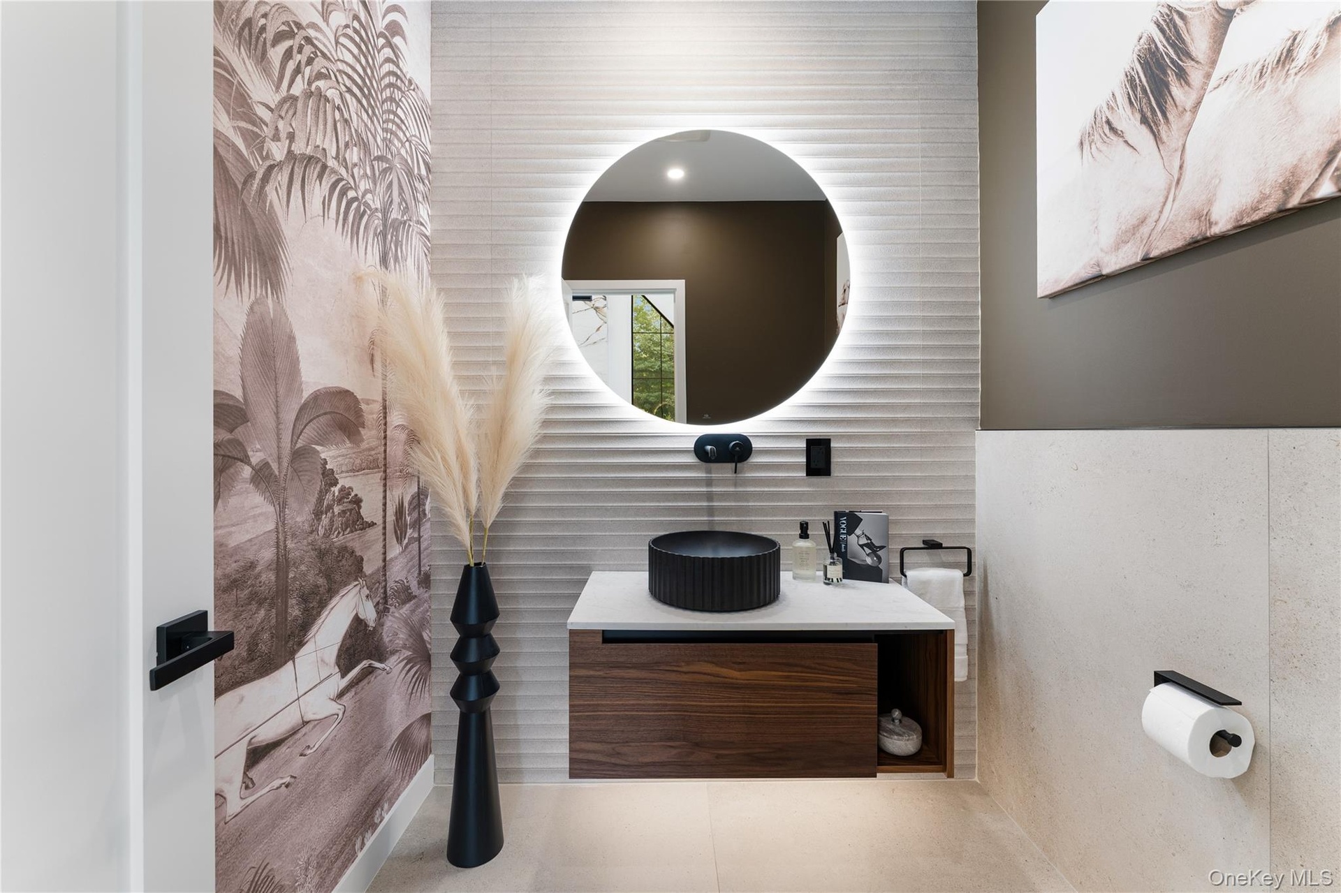 Main Level Half Bath featuring vanity, tile patterned flooring, and tile walls