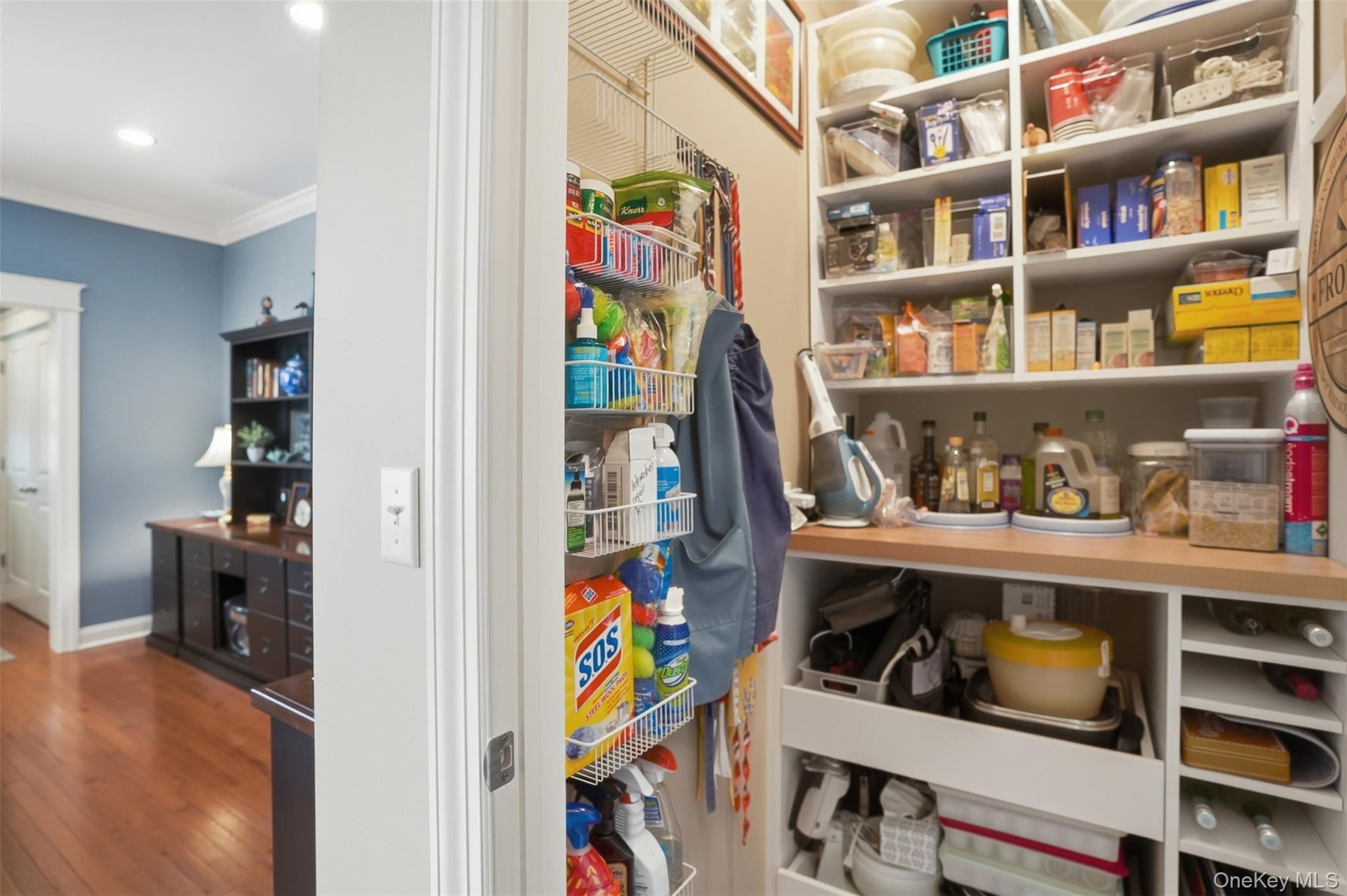Pantry with uniquely custom built-ins with pullout shelves
