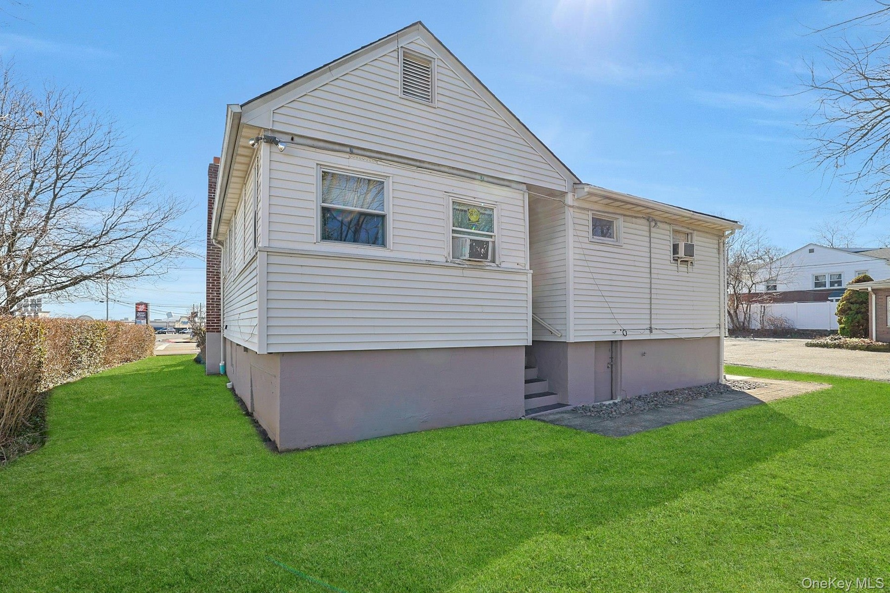 There's an entrane at the back of the building that leads to the apartment on the left side and finished storage space to the right.