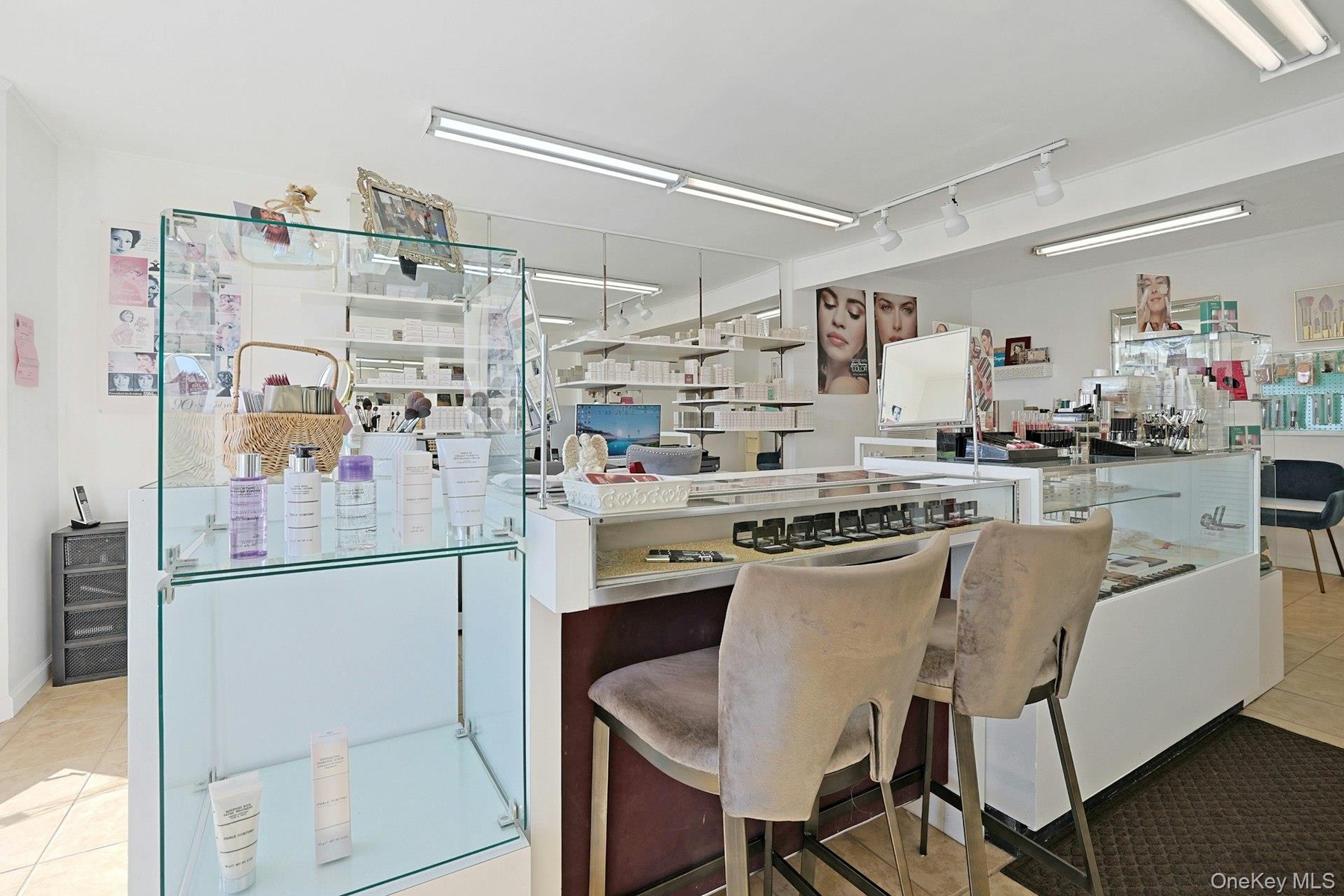 The tall display cases at either end are not included, and the piece with 2 chairs may not stay either.