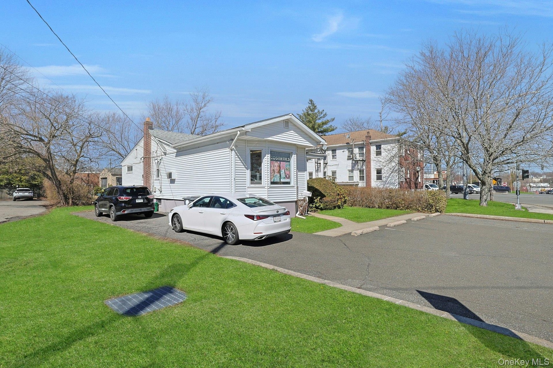 5 parking spaces across the front and room for 2-3 cars in the driveway.