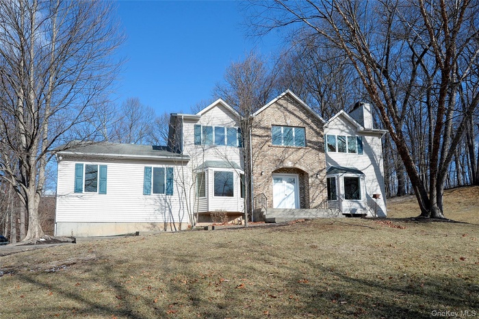 View of front of house with a front lawn