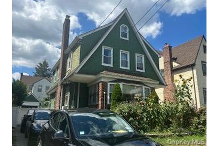 View of front of property featuring a chimney