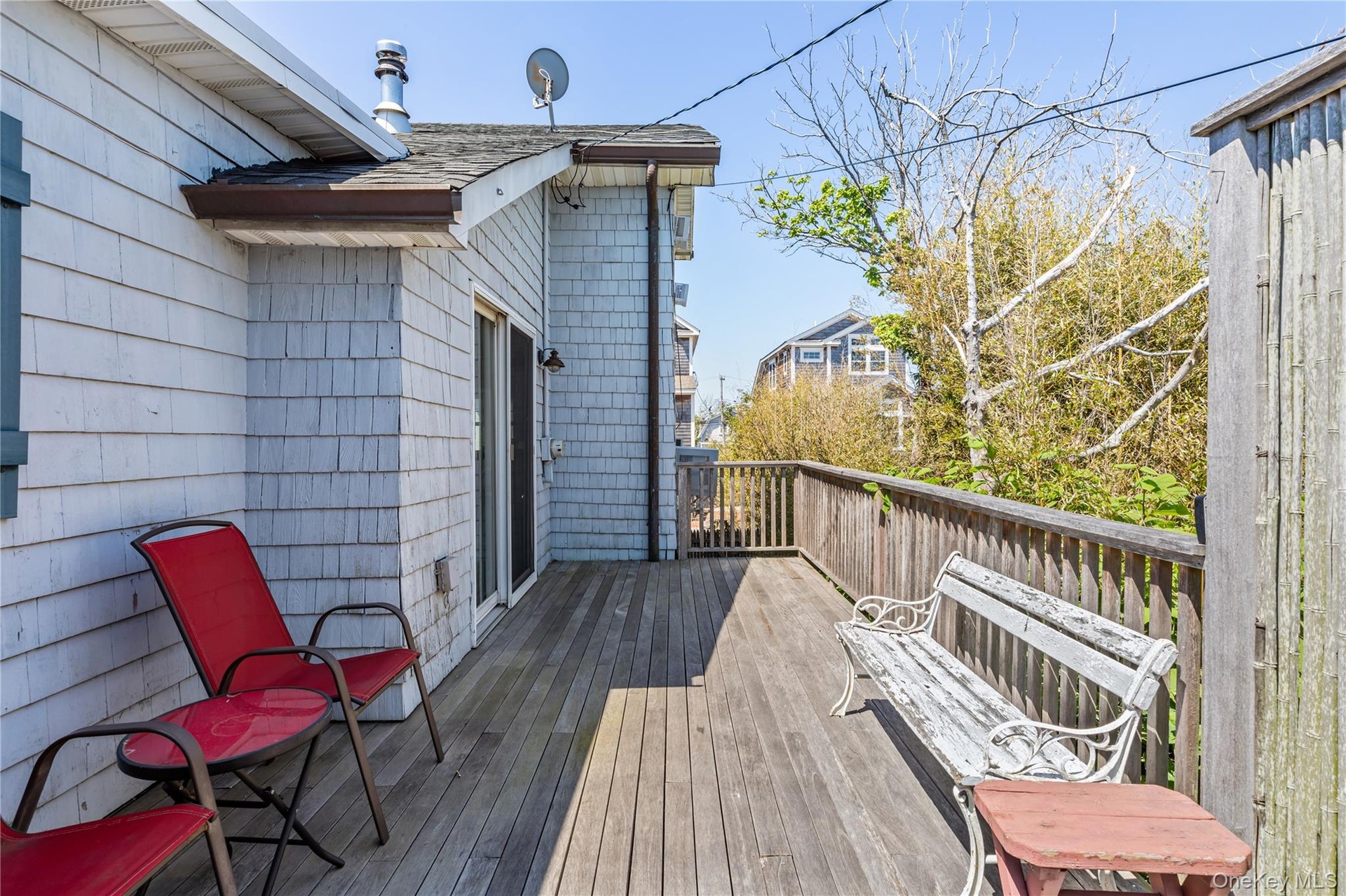 Expansive outdoor deck featuring wood flooring and a perimeter railing
